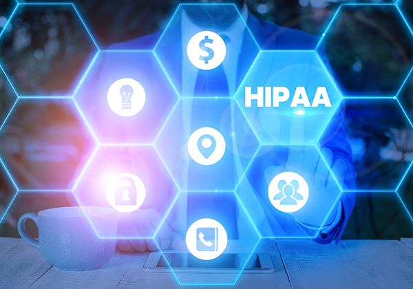 Small digital hexagons line up and the prominent one says “HIPAA” in white text
