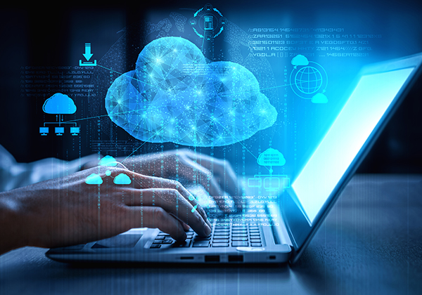 An image of a person using the computer with a digital cloud hanging over the image